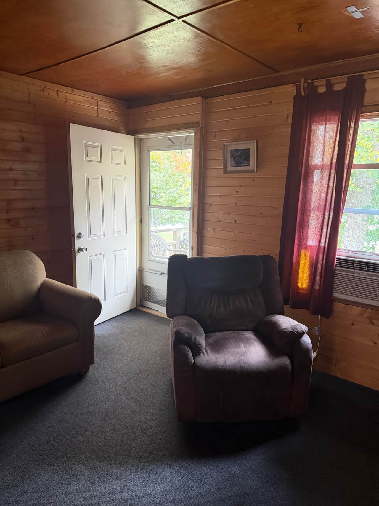 Living room with exit to deck overlooking the lake