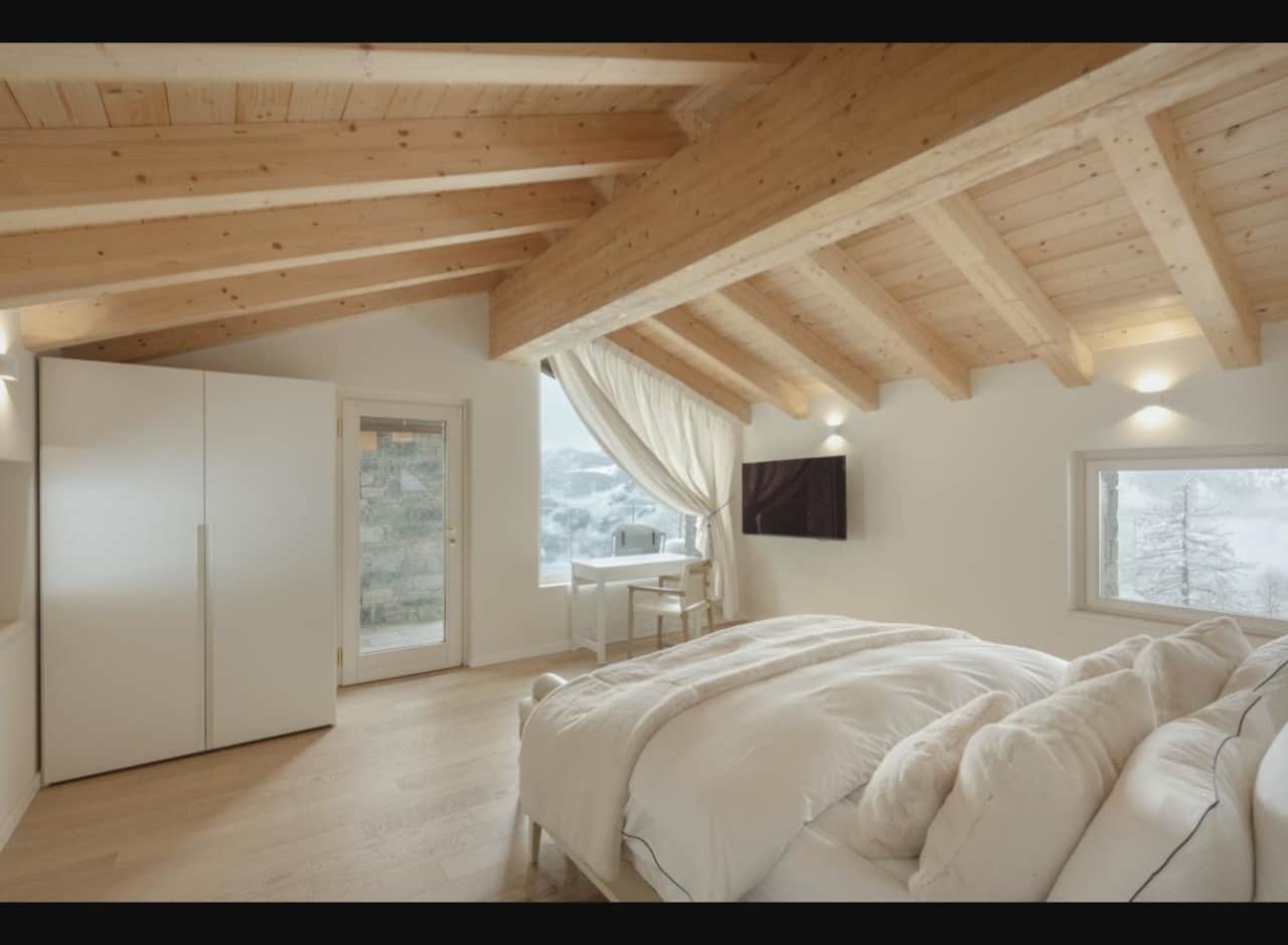 Master bedroom under the larch beams