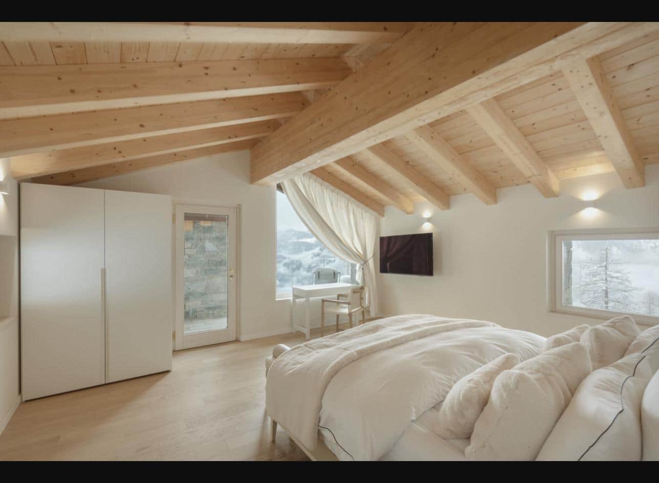 Master bedroom under the larch beams