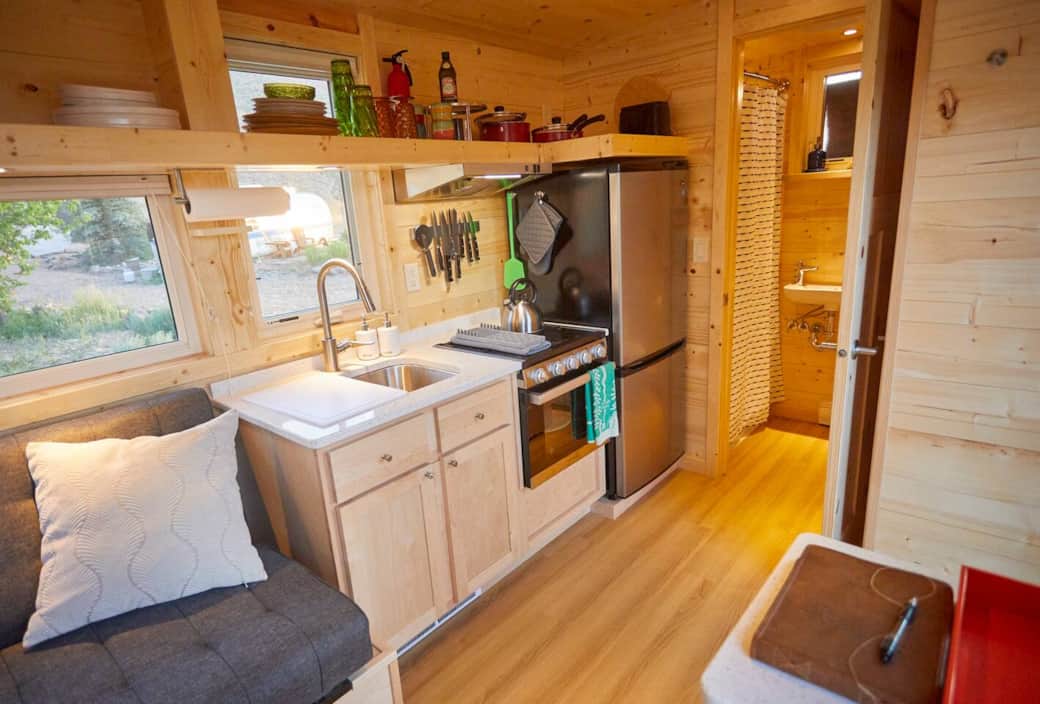 There is a full kitchen including a stove, oven, sink and full size refrigerator/freezer.   Everything you may need to make a full meal. 