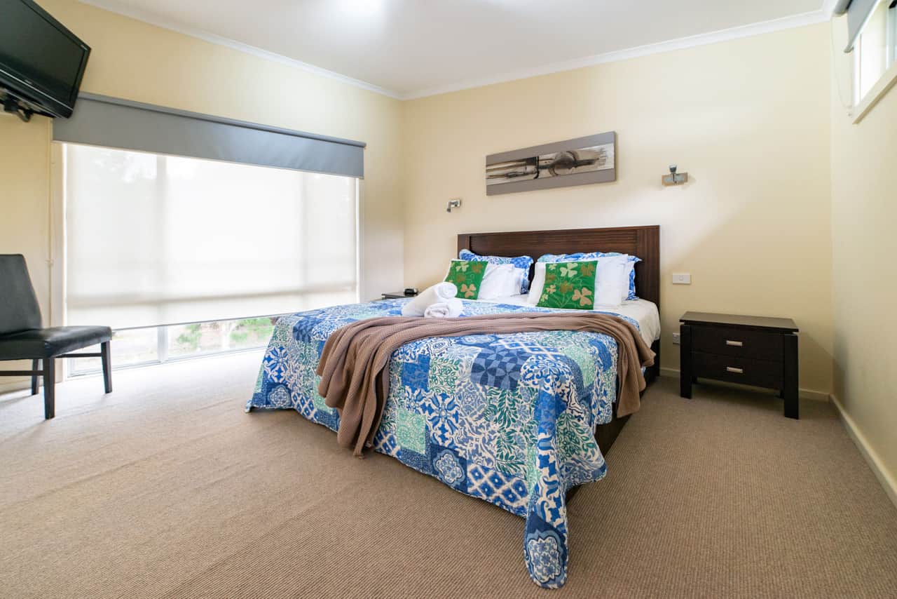 Upstairs luxury: Master bedroom with a king-size bed for ultimate comfort.