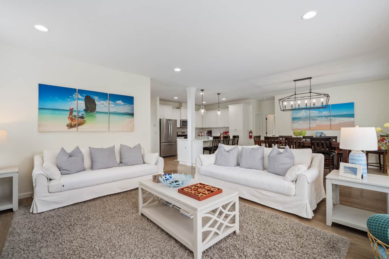 Spacious living room with two large, comfortable and easy-care sofas—perfect for relaxing together.