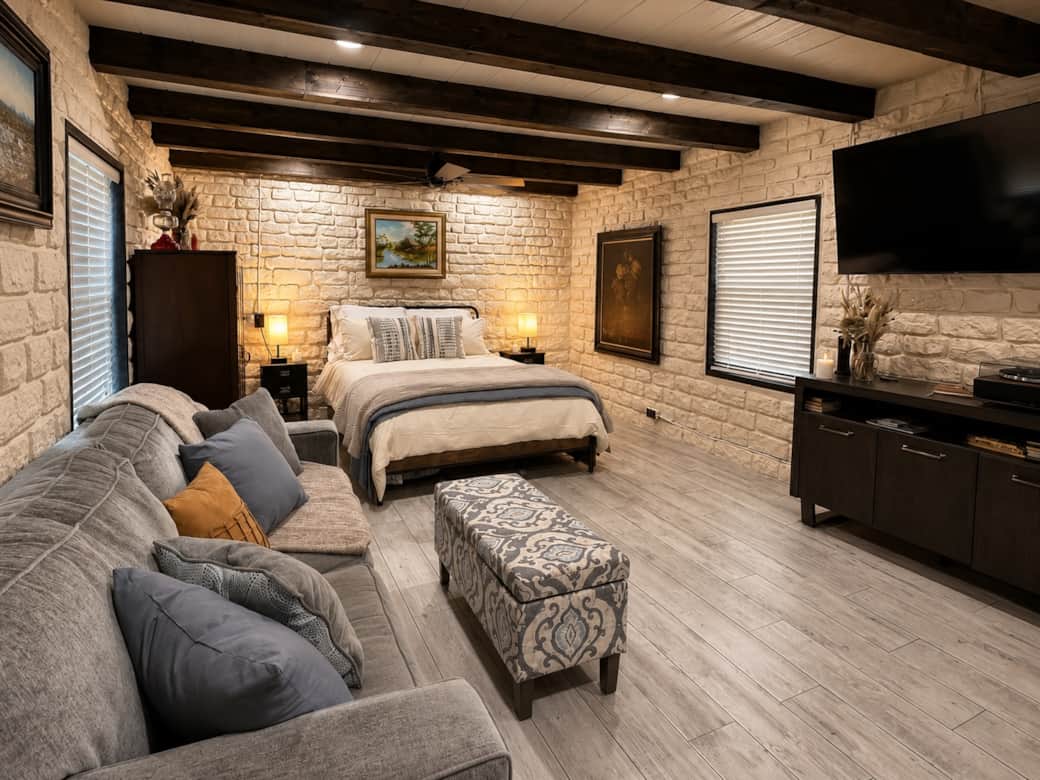 Open, comfortable suite with a queen bed, cozy sofa, and plenty of room to unwind.