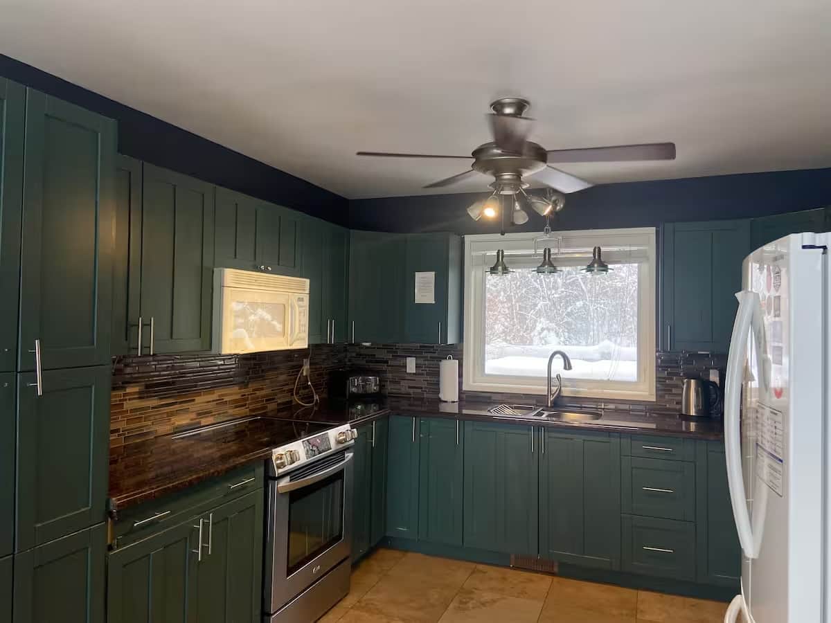 Fully Equipped Kitchen. Front Window overlooks the hot tub and front deck.