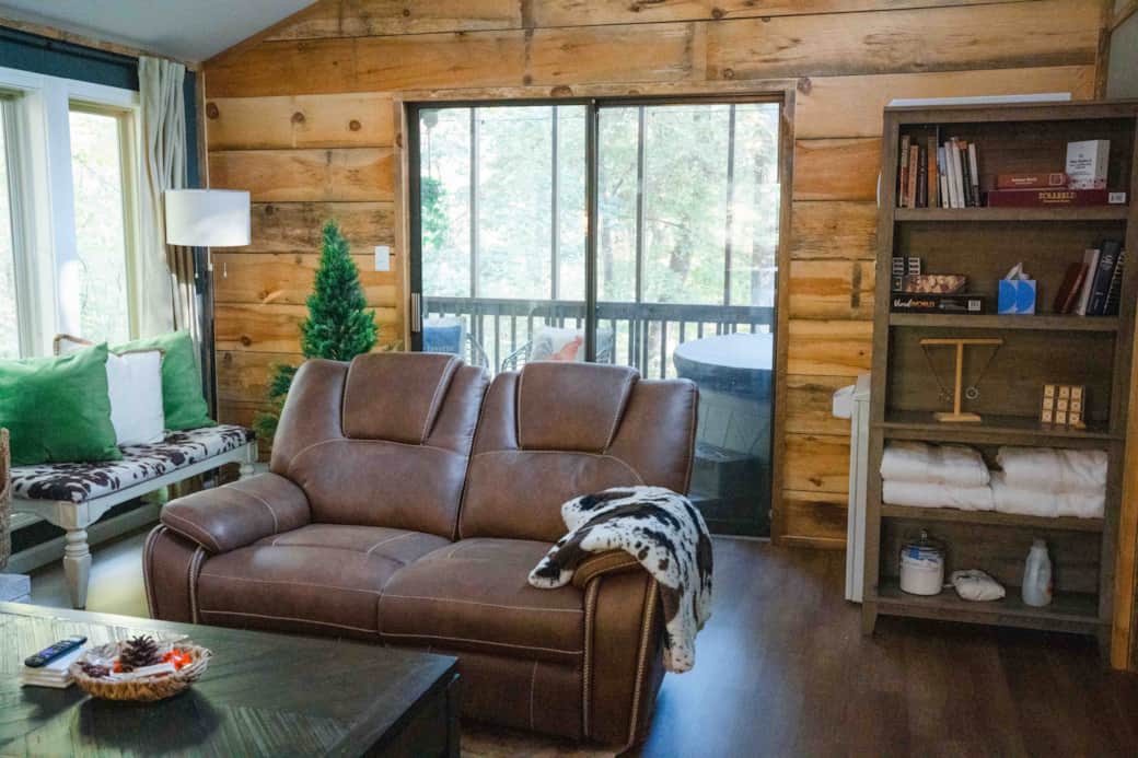 The bookcase provides good reads, games, hot tub towels, laundry supplies & hides washer dryer