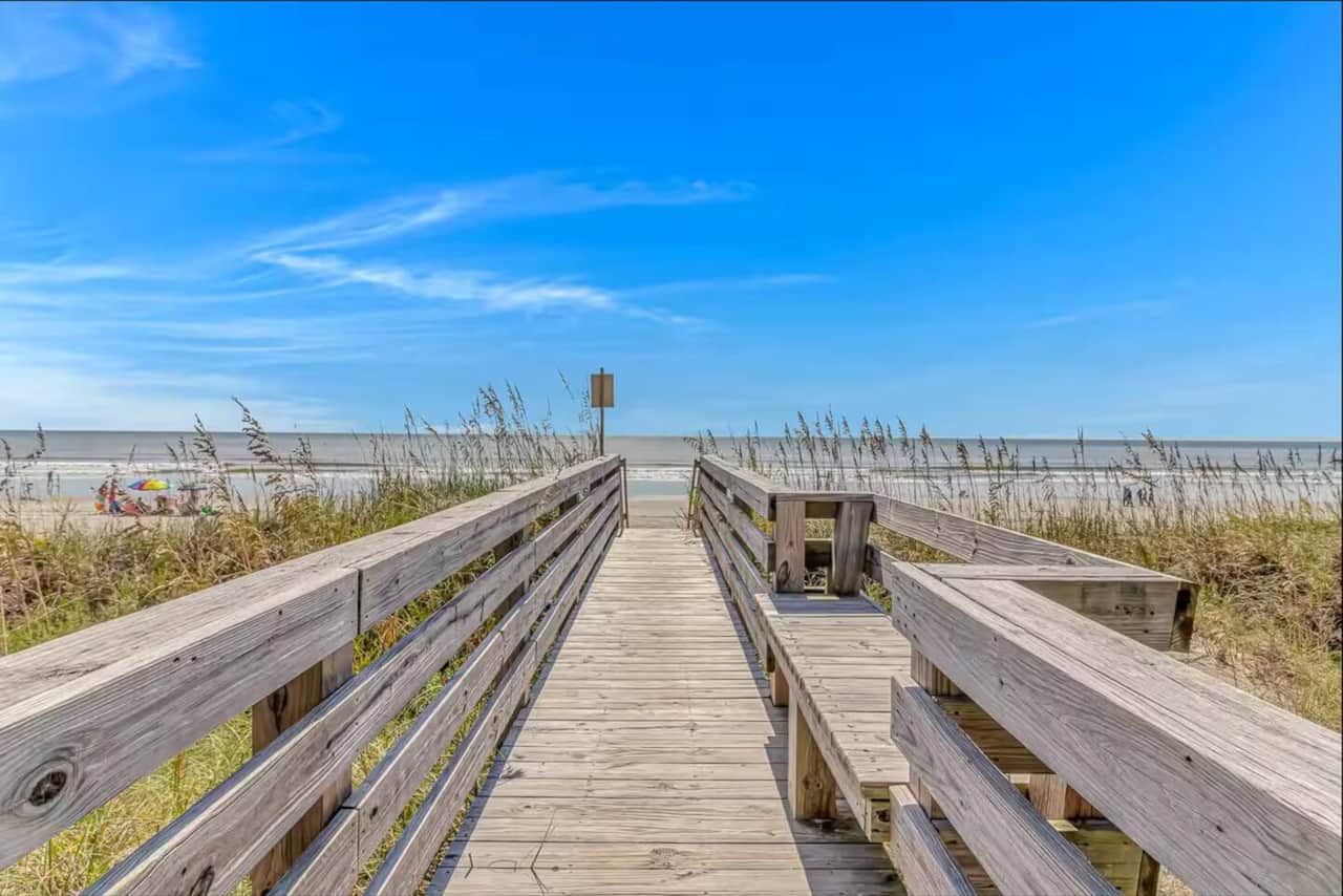 Direct beach access walkway makes getting to the sand quick and easy.