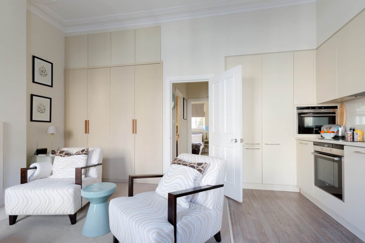 Open-plan living space with kitchen access, Earls Court flat