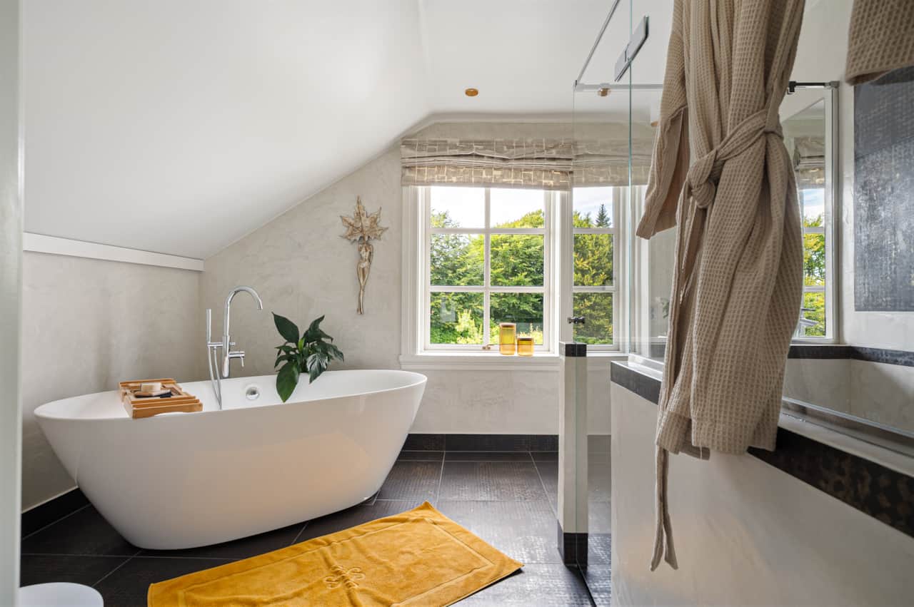Luxury bathroom with freestanding tub and walk-in shower.