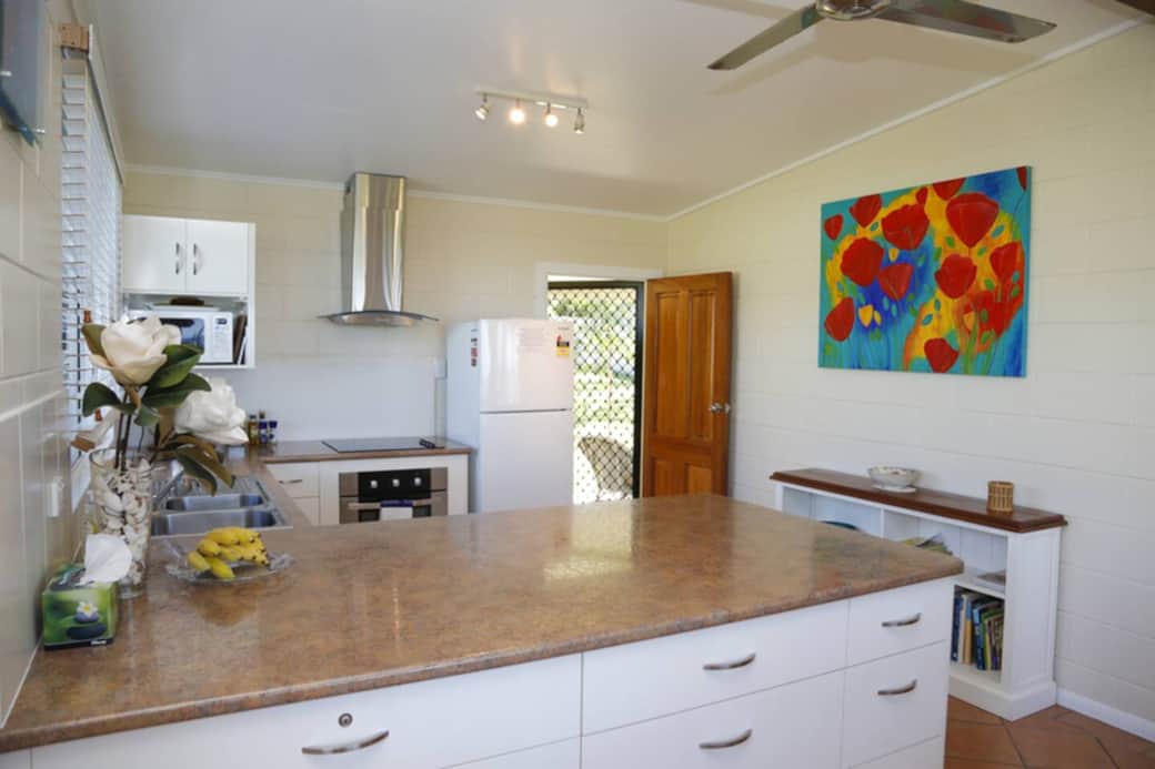 Shalom by the Sea - Fully equipped kitchen with door access through to backyard and bathroom. Bathroom located outside