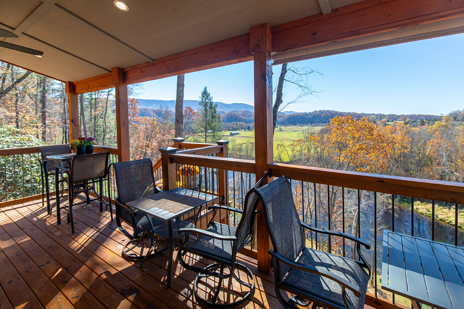 Guests lounging on cushioned chairs on Great Blue Heron lower deck