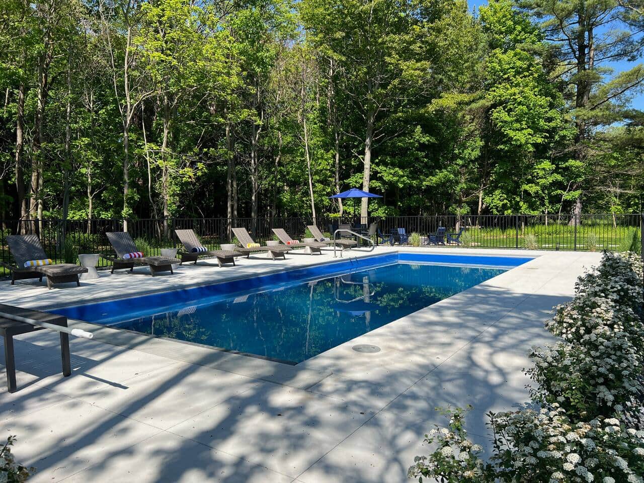 Heated pool with lounge chairs