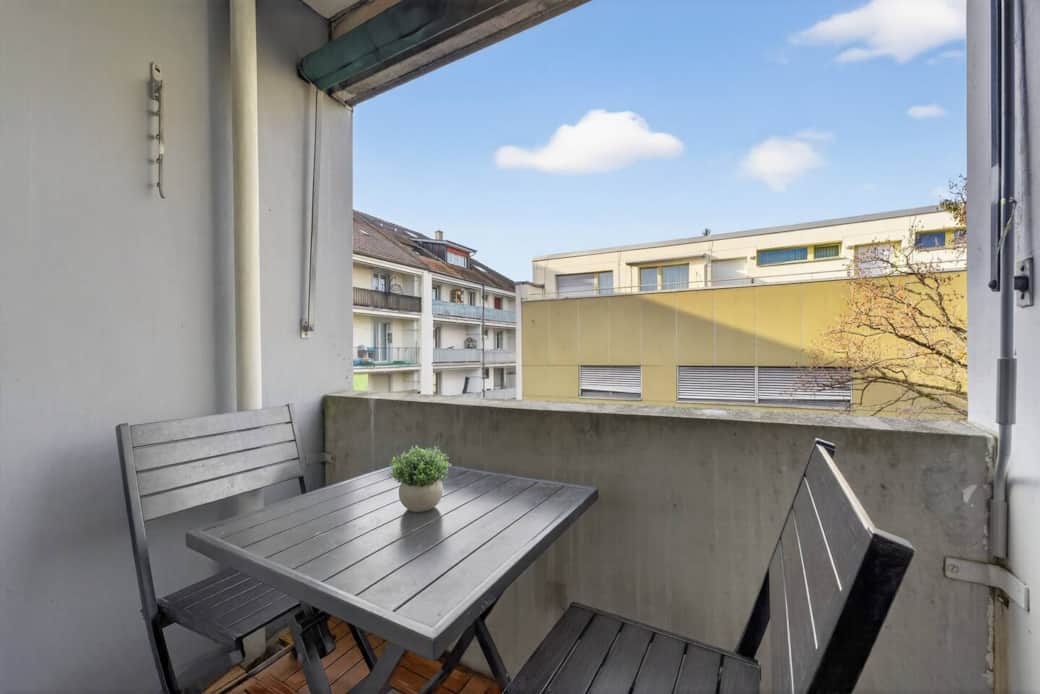 Private balcony with seating — perfect for morning coffee or fresh ai