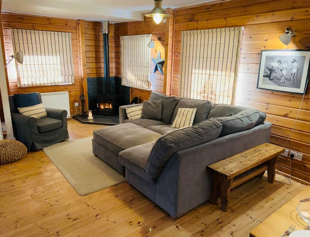 Plush sofa and pouffe, log burner