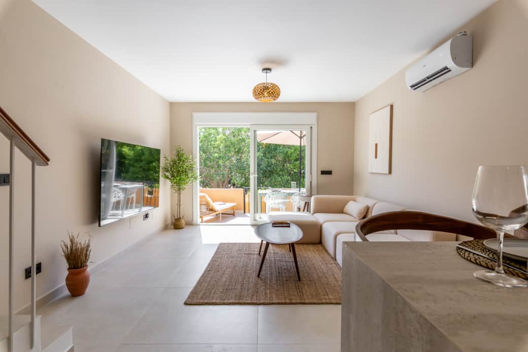 Modern living room. With 70inch tv. open plan kitchen. cold aircon. 