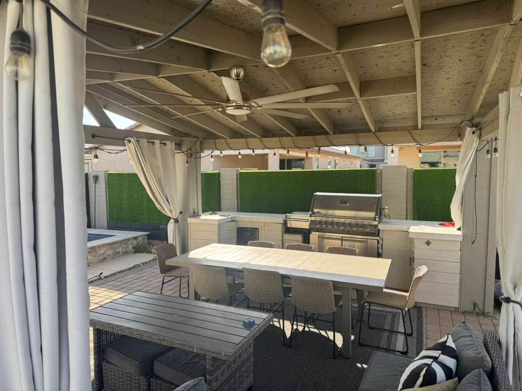 Gazebo with BBQ with outdoor seating 