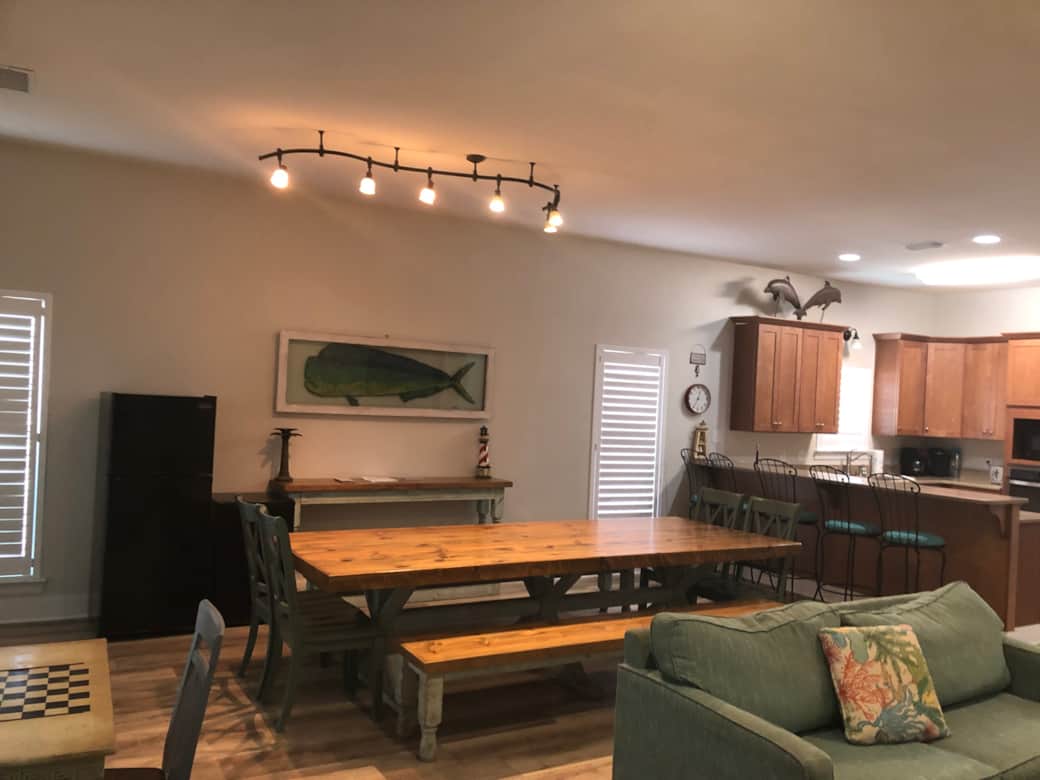 Custom dining room table has seating for 12. Ten cubic foot fridge for drinks. Custom dining room table has seating for 12. Ten cubic foot fridge for drinks.