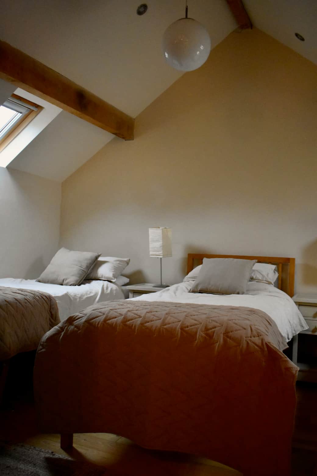 Hayloft family bedroom with three single beds and one single sofa bed