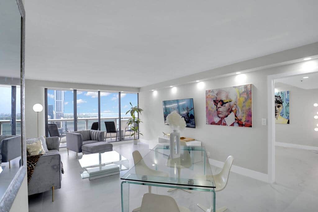 Dining area for 4, living area with Roku streaming tv, balcony access, water views of Biscayne Bay