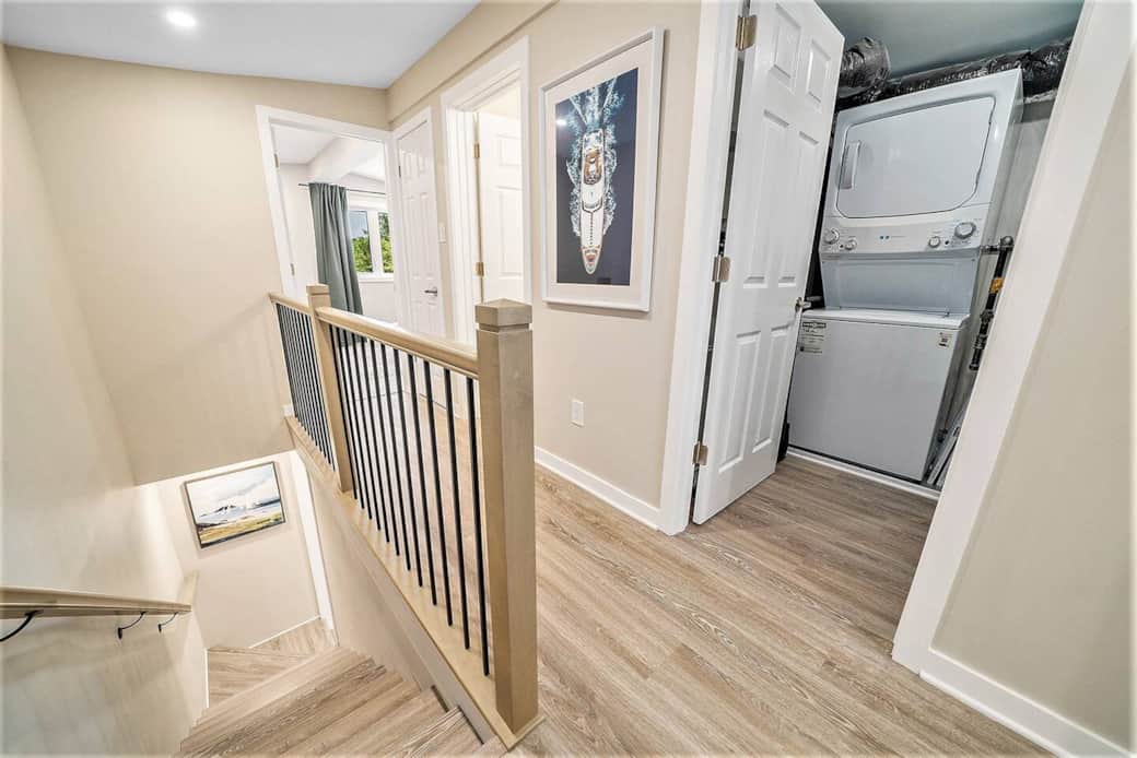 this hallway guides you to the office/spare bedroom, full bathroom, laundry and primary bedroom. this hallway guides you to the office/spare bedroom, full bathroom, laundry and primary bedroom.