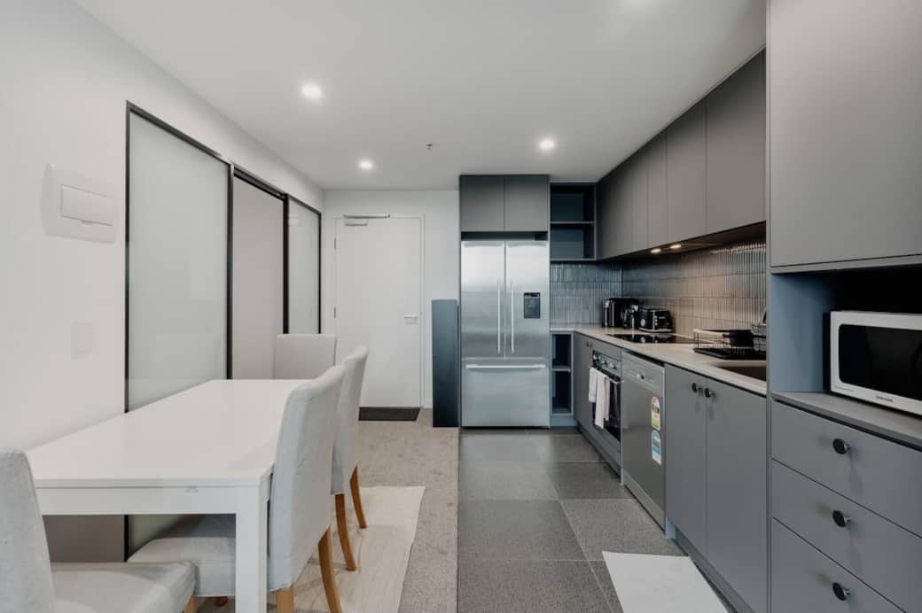 The adjoining dining area is perfect for enjoying meals, whether you're cooking up a storm or simply enjoying a dinner. This space is designed to inspire creativity and provide a comfortable environment for dining, making it a hub for creativity.