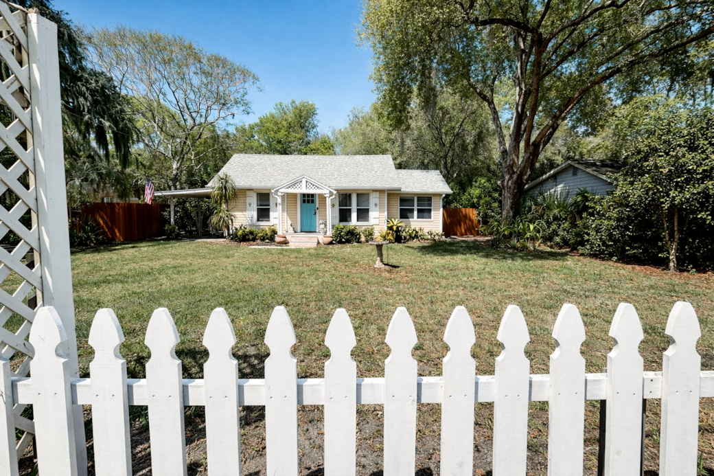 Quaint cottage with a generous front yard, offering space to unwind 