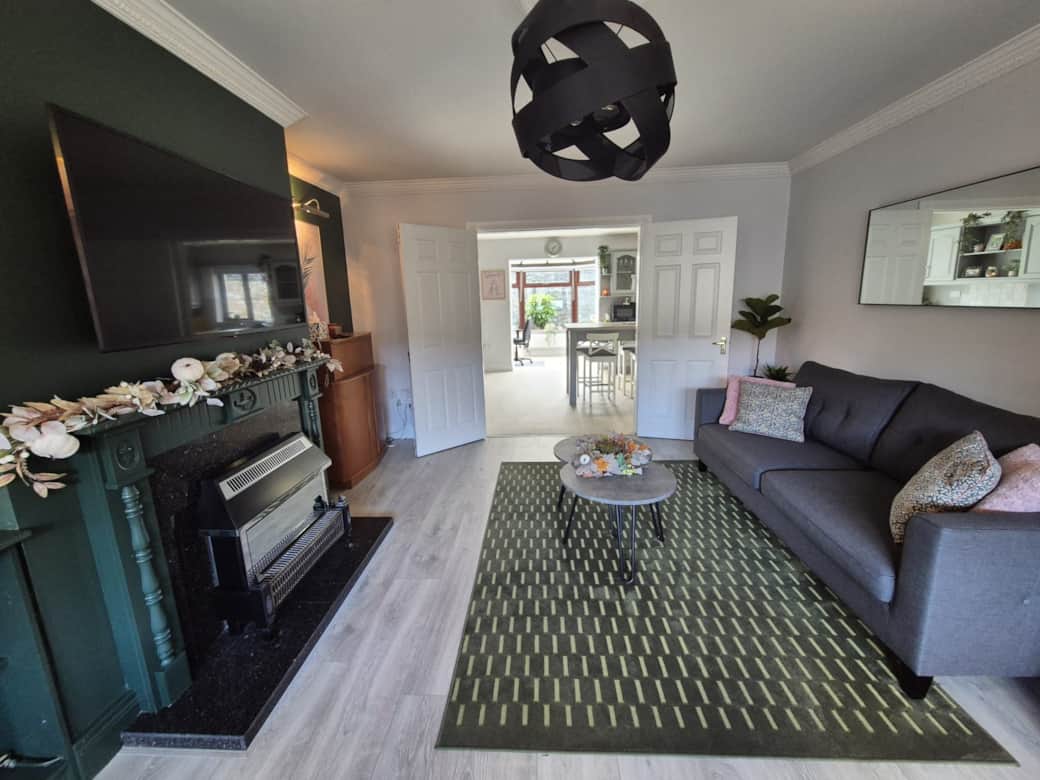 Living room with double doors into kitchen