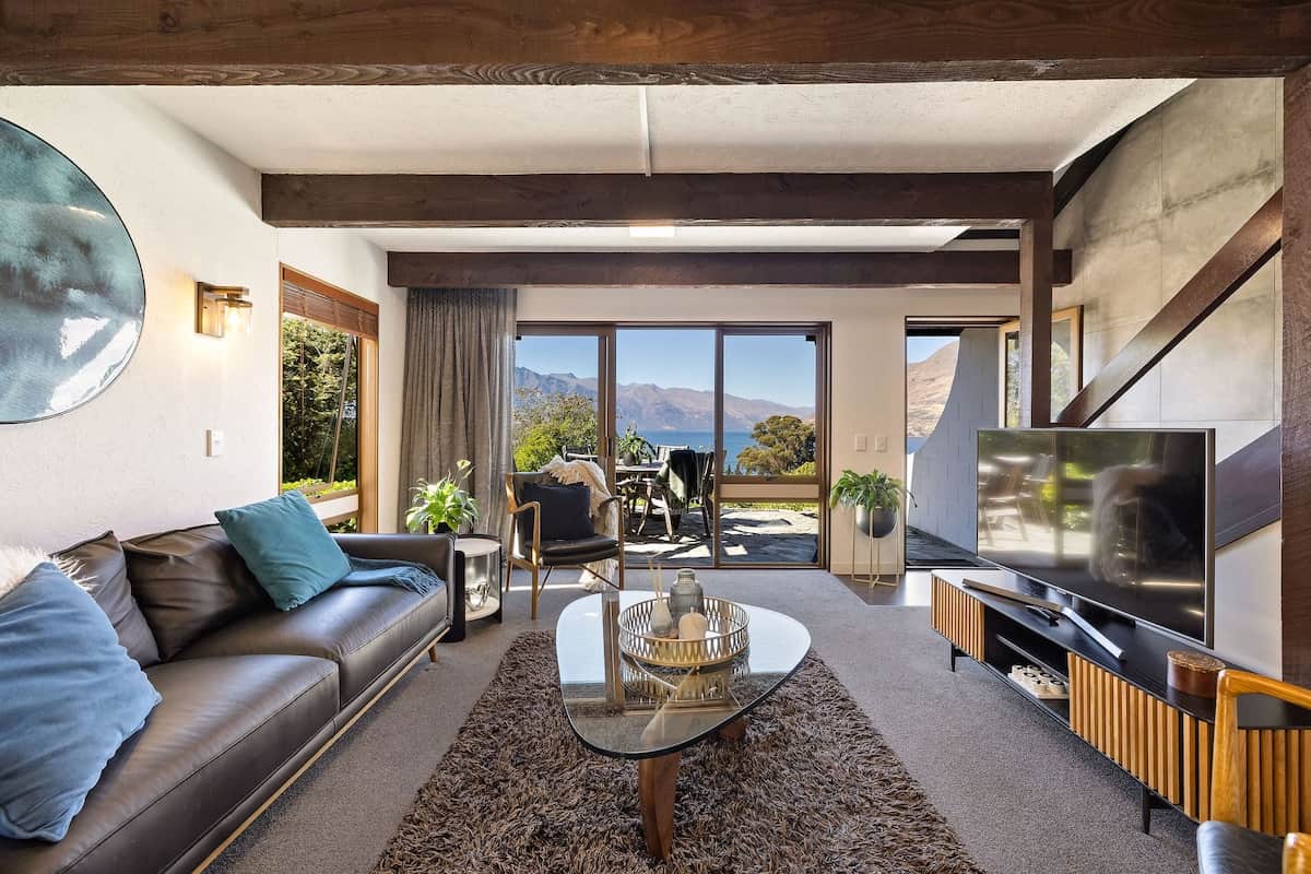 Spacious living room with Remarkables views at Walk to Town 39B Alpine Chalet Queenstown