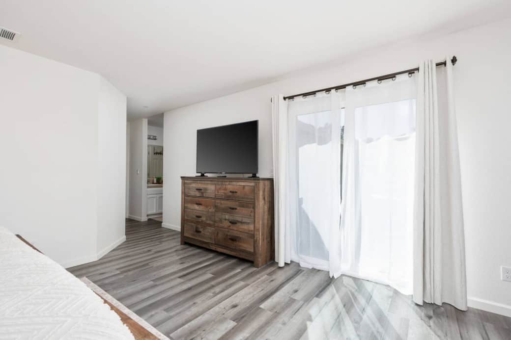 Large 55 inch TV along with blackout curtains is provided in the primary bedroom. Large 55 inch TV along with blackout curtains is provided in the primary bedroom.