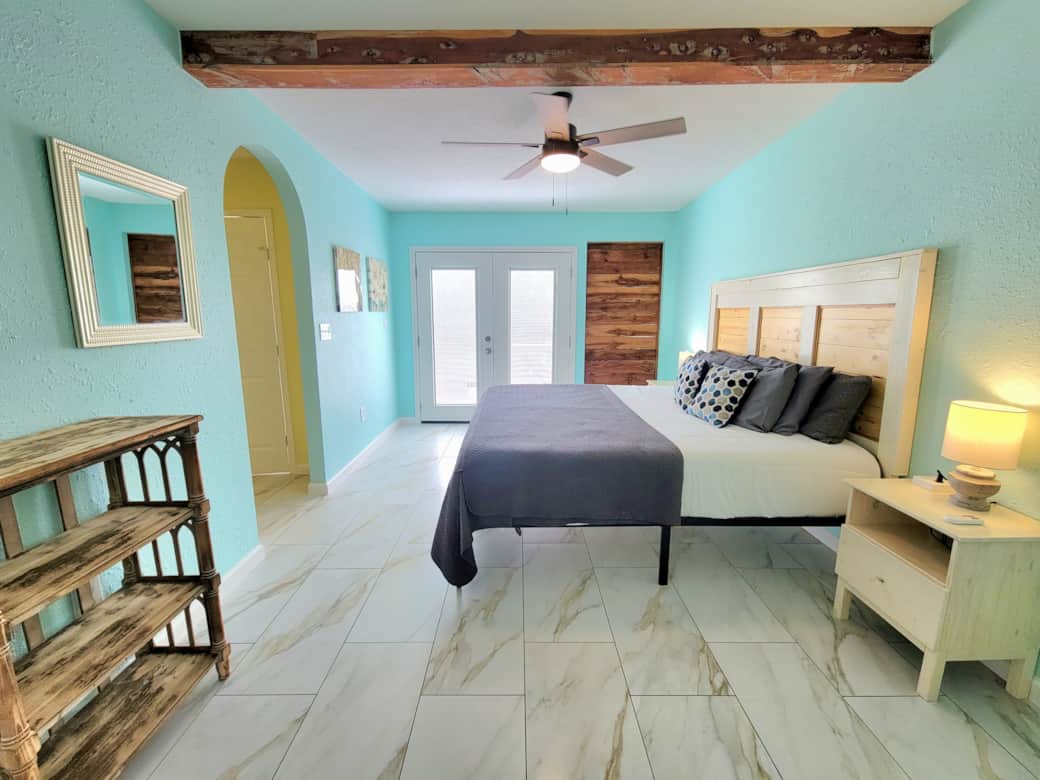 The king downstairs master bedroom is roomy and elegantly decorated.