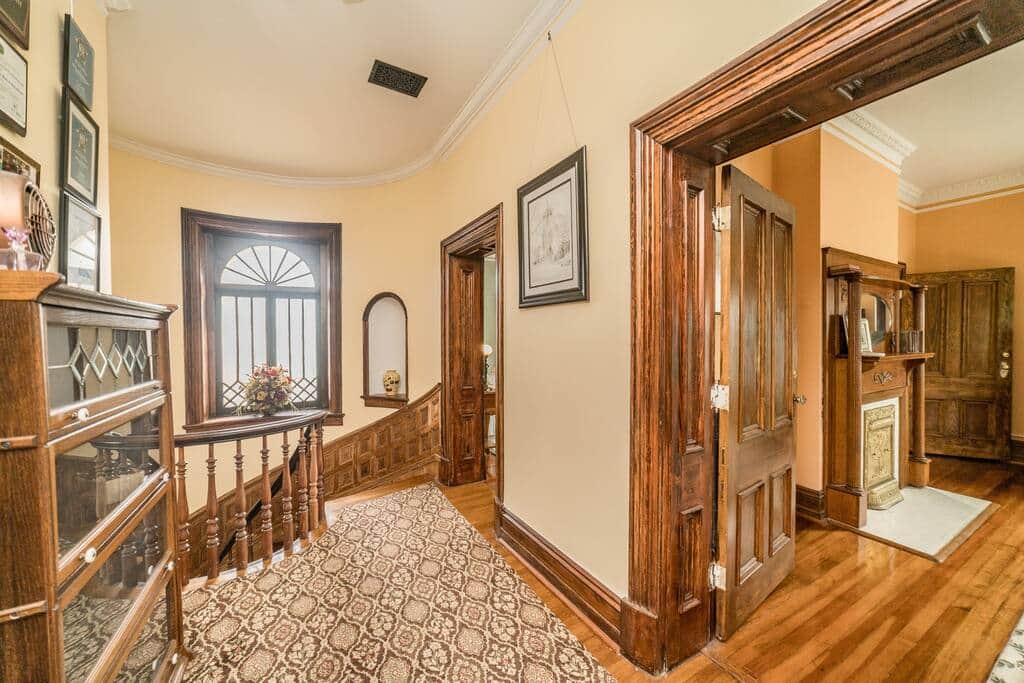 The stairway that you'll walk down after exiting your suite