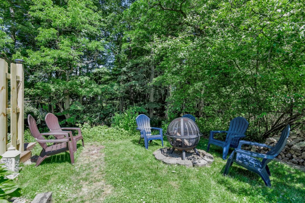 Creekside fire pit surrounded by trees for relaxing evenings after your adventures Creekside fire pit surrounded by trees for relaxing evenings after your adventures
