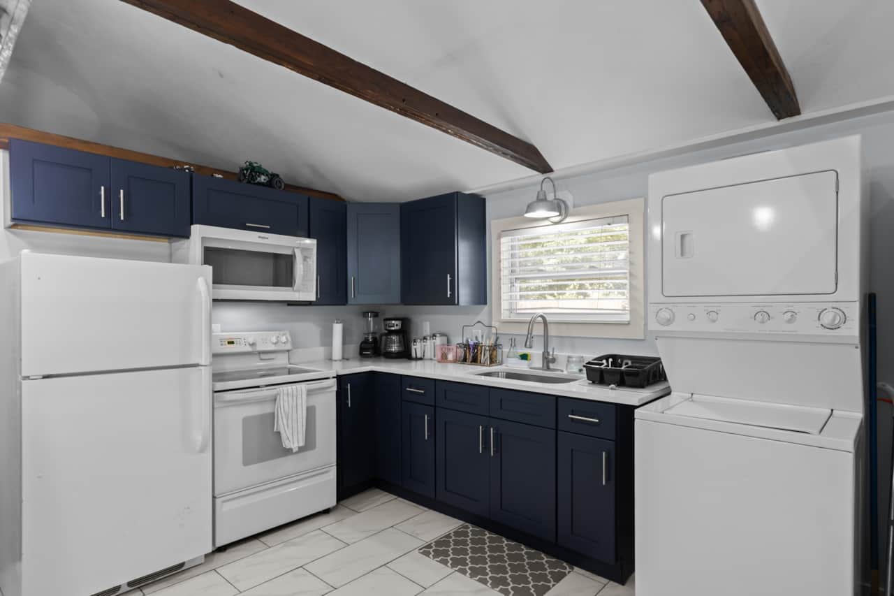 6. Fully stocked kitchen with pots, pans, cooking supplies, blender, toaster, steam cooker, coffee, 