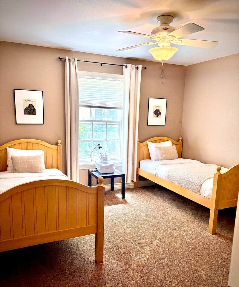Main Floor Bedroom 3 (Two Twin Beds) – Perfect for kids or friends, keeping everyone close on the same level. Twin size rollaway bed available in the closet if needed.