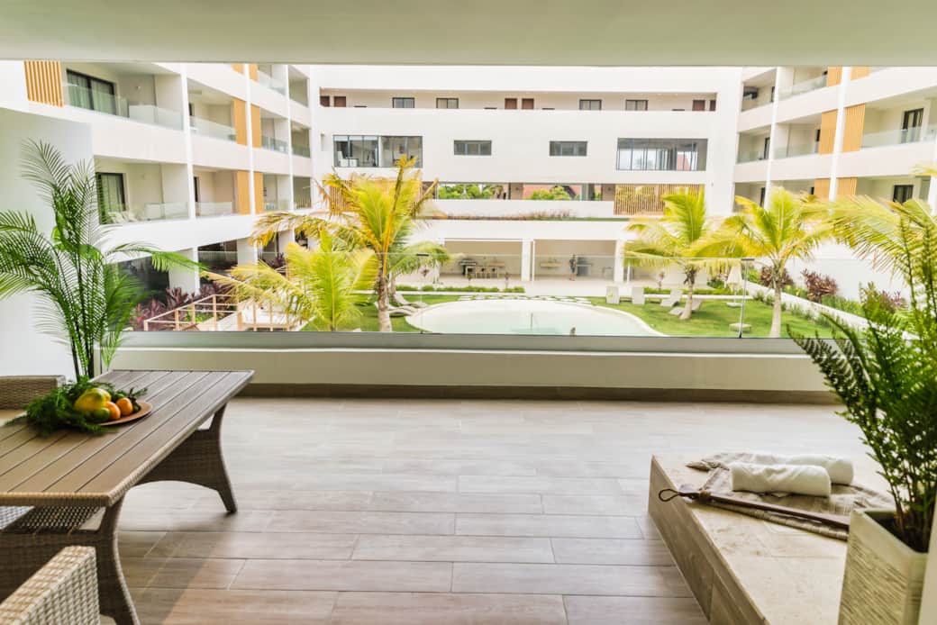 Large Private Balcony with Pool View and Tropical Courtyard