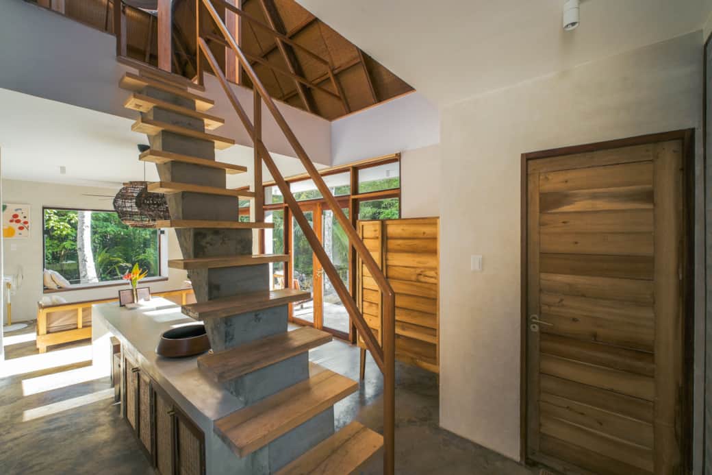 Follow the stairs to loft bedroom, cleverly rising from concrete counter