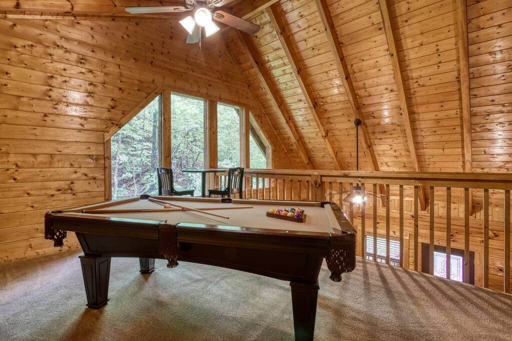 Loft with pool table and seating for two. Loft with pool table and seating for two.
