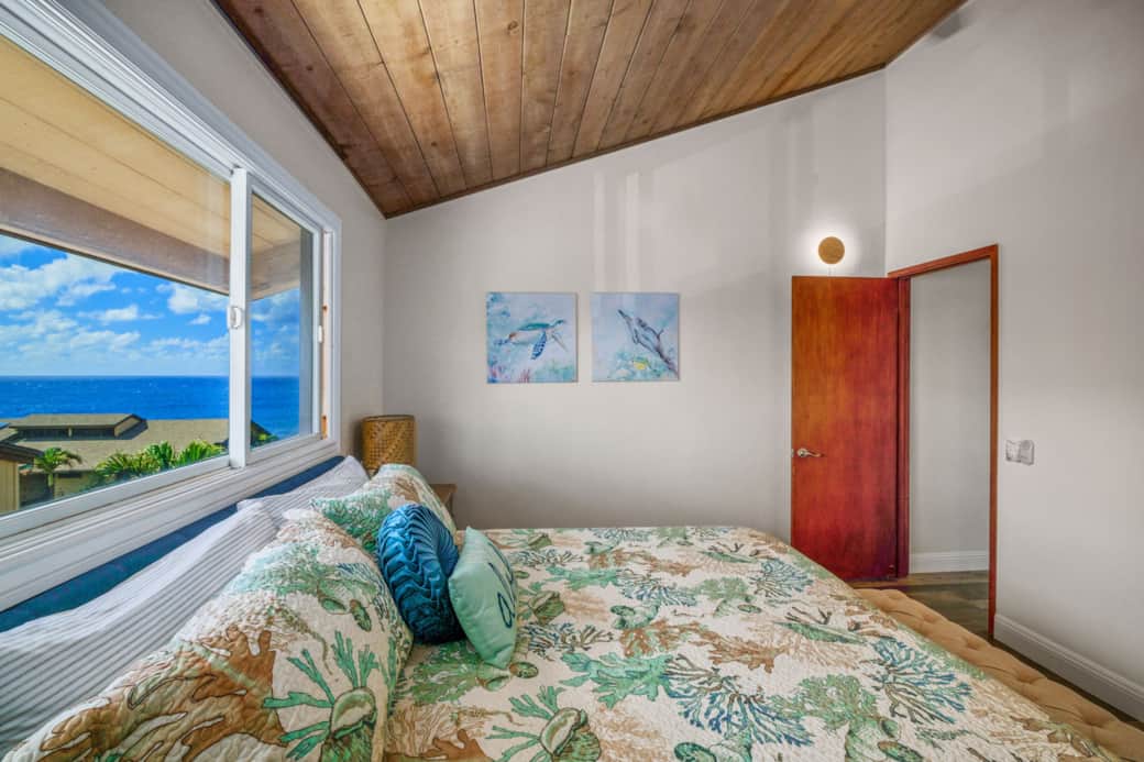 Wake up to ocean views from bed in this bright, breezy room with island-inspired touches