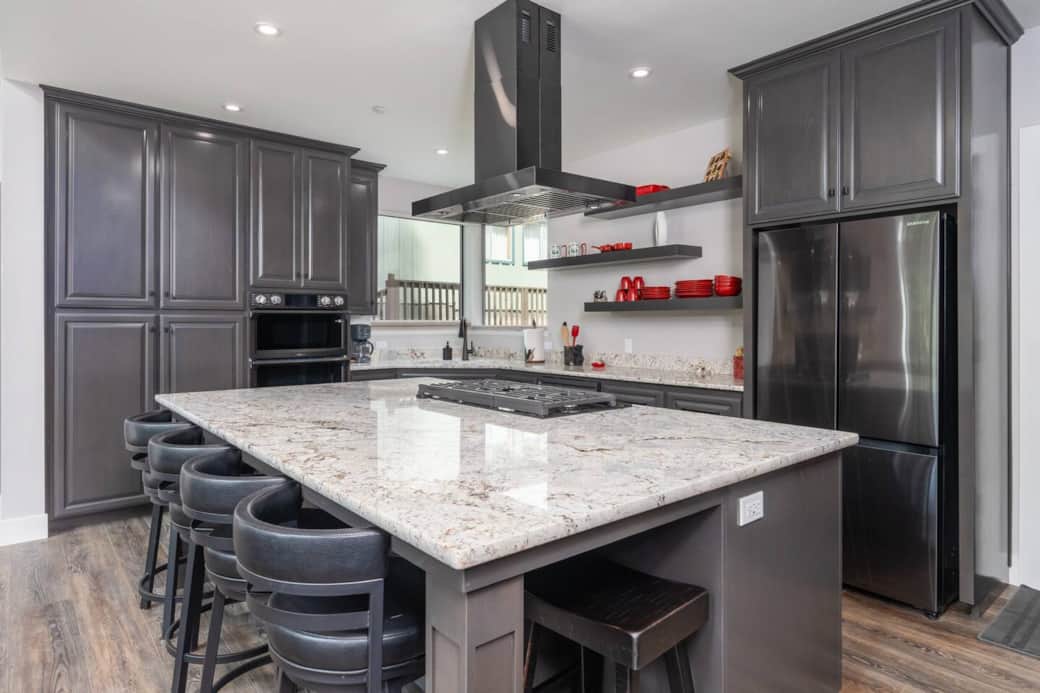 Extended countertop to seat six... four along front length of counter and seating for one on each side. 