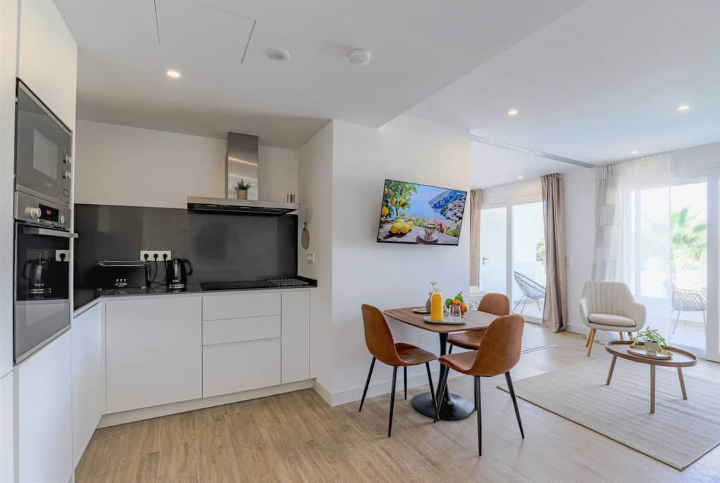 Modern open-plan living with natural light & terrace views Modern open-plan living with natural light & terrace views