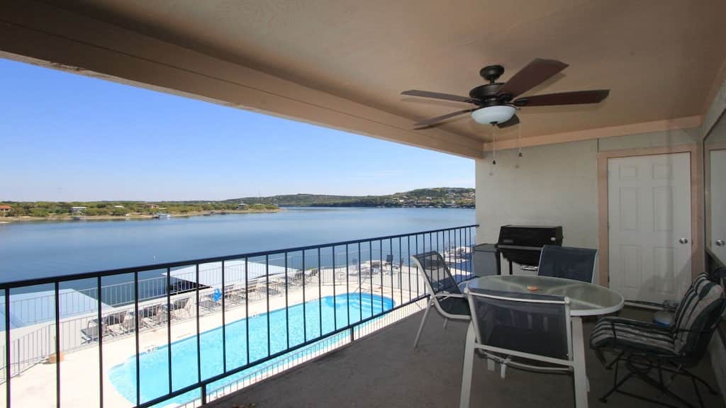 Private patio with outdoor seating and propane grill