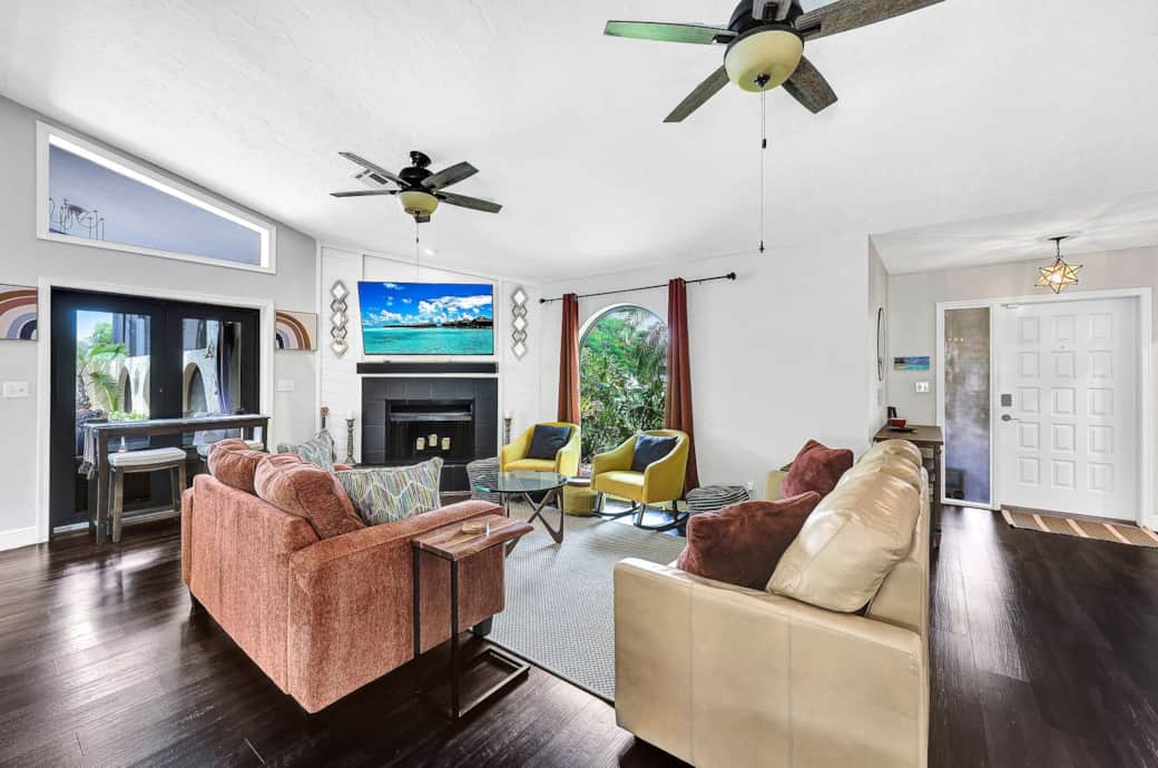 With a large TV, ample seating, our living room overlooks the pool area, with a queen size sofa bed.