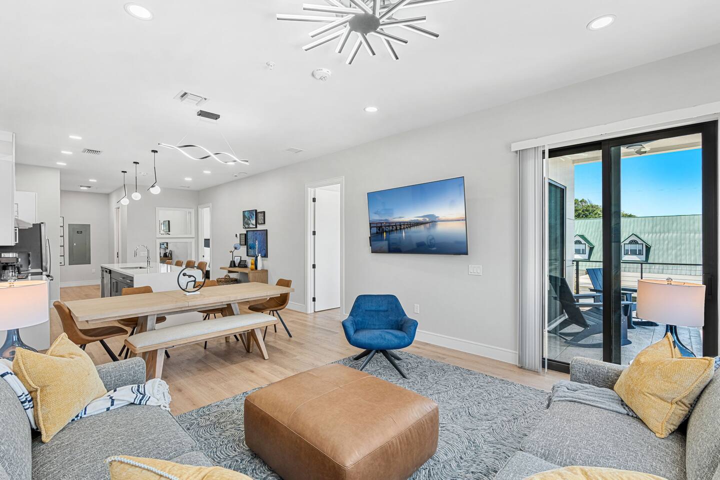 A stylish living room to unwind, offering an abundance of natural light and comfort.
