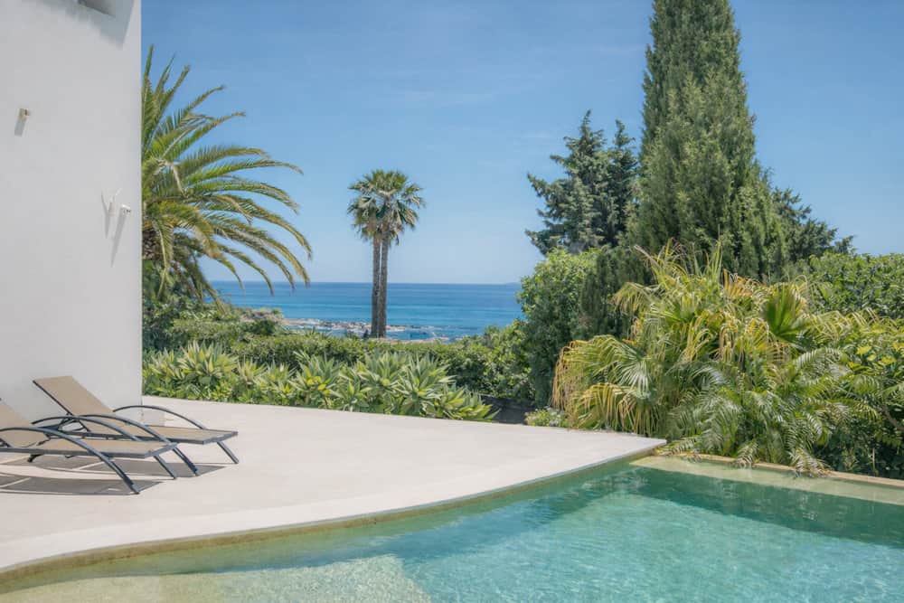 Edge of the infinity pool at Villa Luz Bliss with the Atlantic beyond