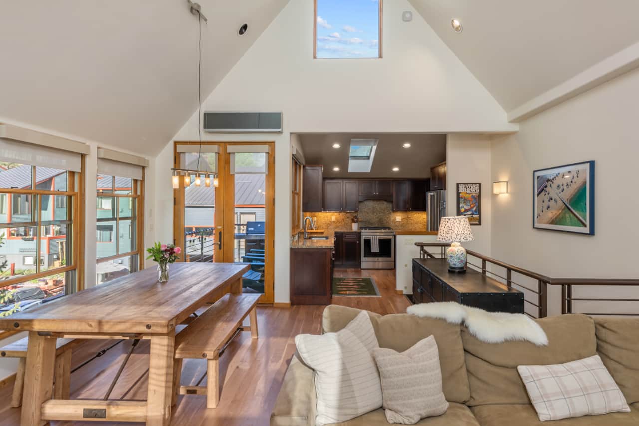 The open sitting and dining area on the top floor features plenty of seating and light