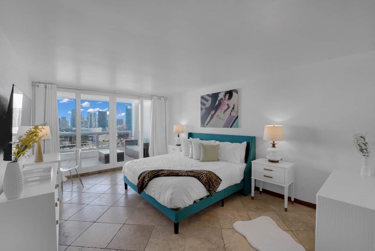 Master bedroom suite, king bed, balcony access, desk, Roku tv, walk in closet, private bathroom