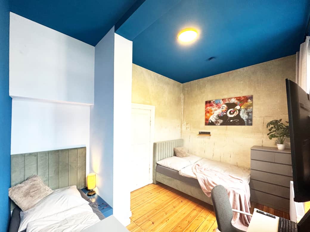 Gemütliches Schlafzimmer mit Doppel- und Einzelbett Gemütliches Schlafzimmer mit Doppel- und Einzelbett
