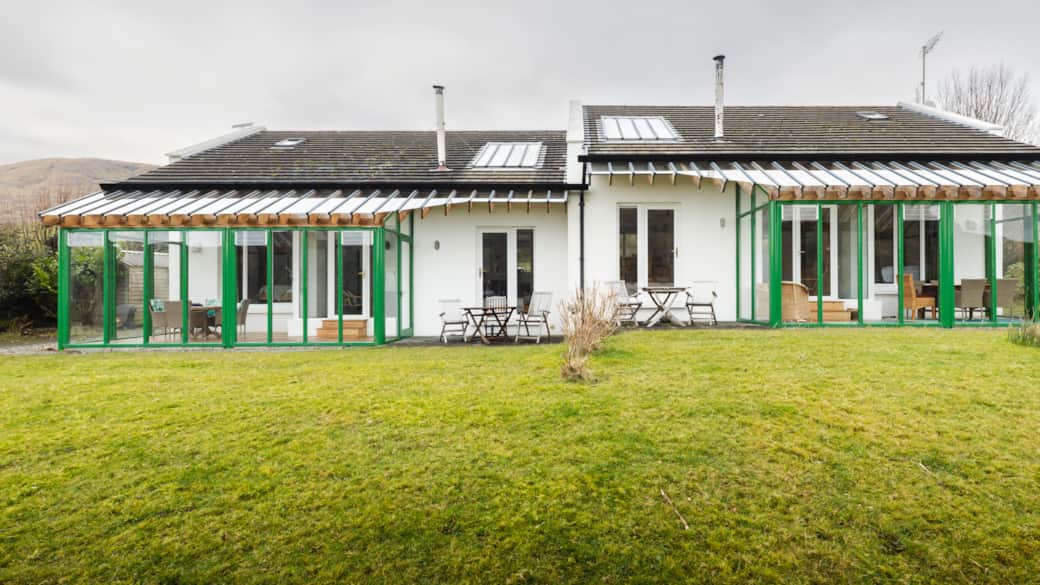 Expansive floor-to-ceiling windows flood the living room with light and frame stunning views Expansive floor-to-ceiling windows flood the living room with light and frame stunning views