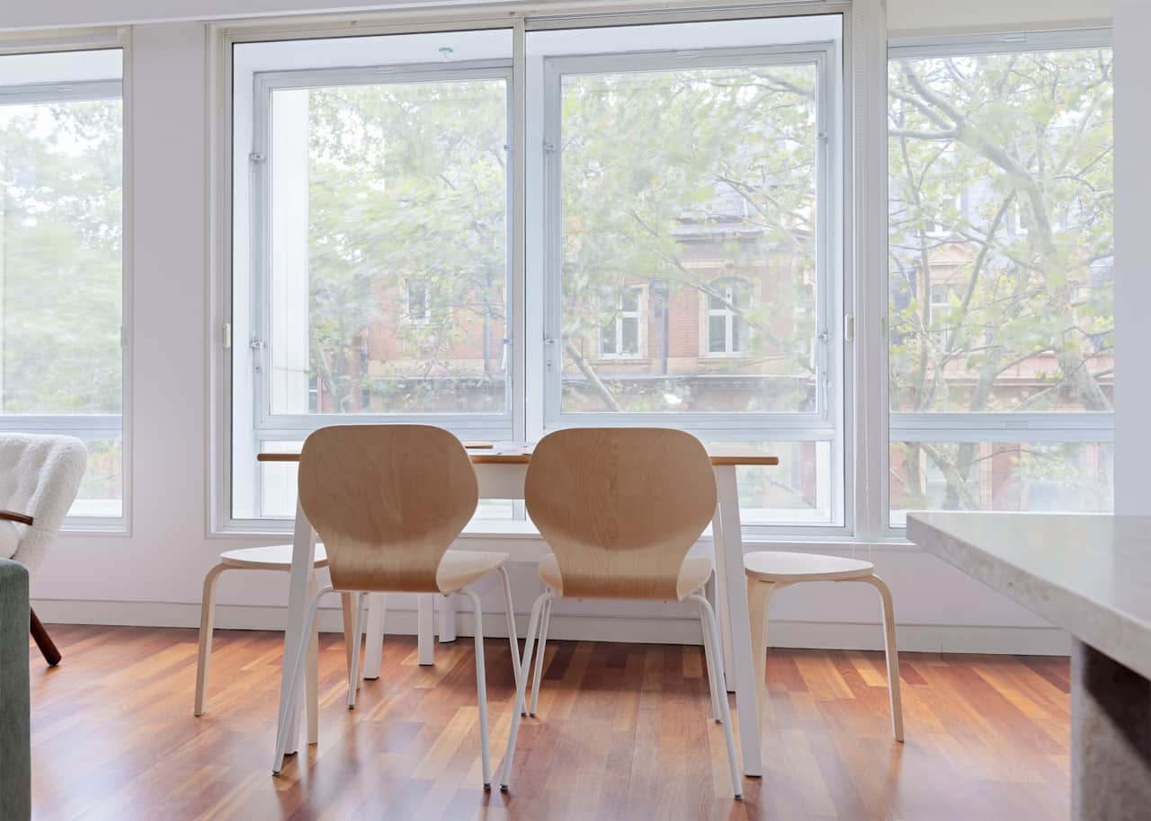 Dining area beside large double-glazed windows