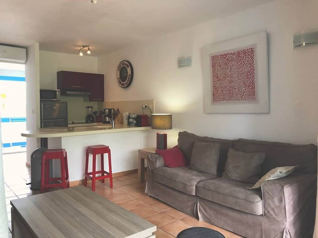 Living room with sofa bed Lataniers 12