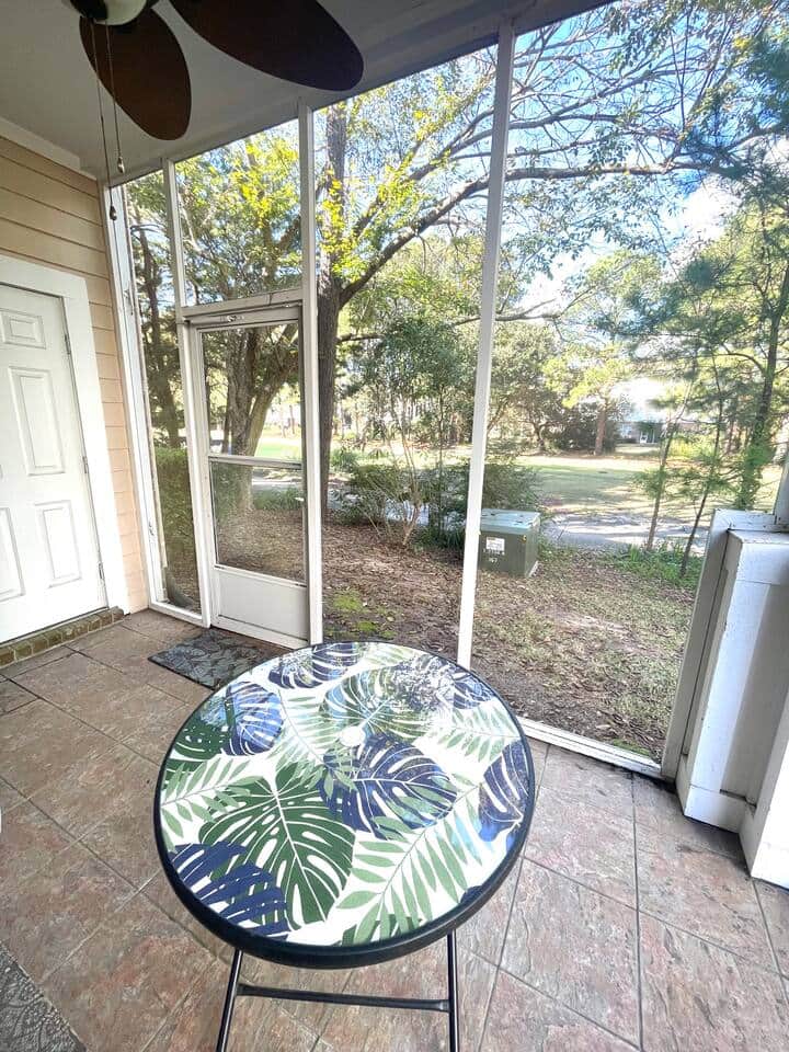 Screened porch with garden view